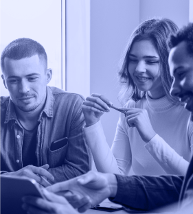 A group of people checking something in a tablet