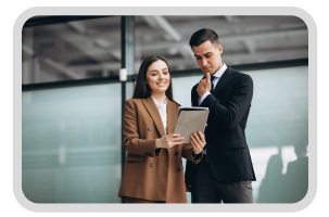 man and woman holding a tablet and discussing about work in office environment
